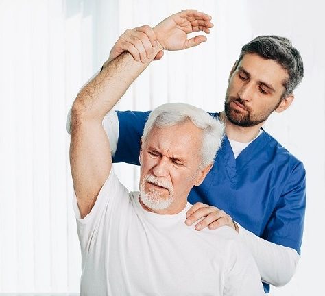 physical therapist with senior patient